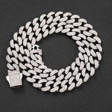 Macro detail of 12mm silver Cuban chain link necklace with micro-pave cubic zirconia