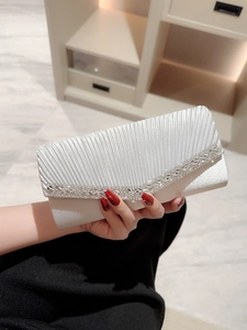 Elegant white pleated satin evening clutch bag with V-shaped rhinestone trim and strap