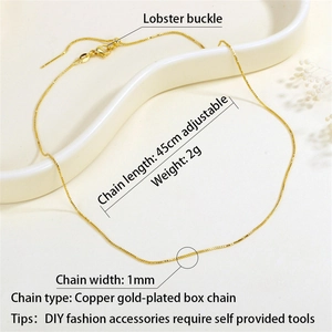 Close-up of a 45cm gold-plated box chain with lobster clasp on a white tray