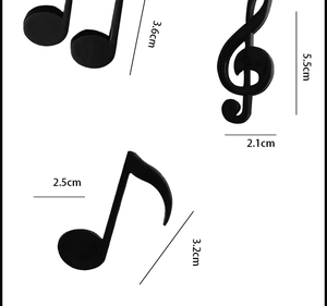 Detailed size chart of black music note magnets showing dimensions in centimeters