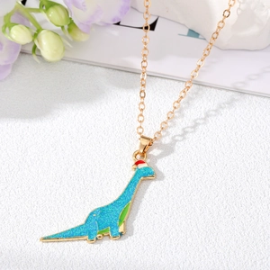 Cute golden necklace with blue glitter dinosaur pendant wearing a red Christmas hat