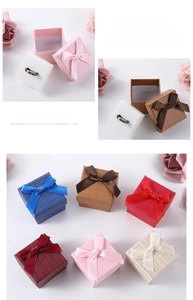 Detail of square jewelry gift boxes with bows and sponge inserts in six vibrant colors
