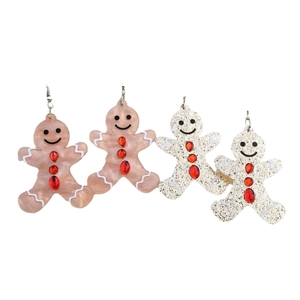 Ensemble de boucles d'oreilles bonhomme de pain d'épices avec paillettes rouges