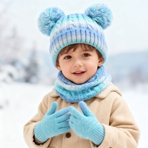 Detail of blue gradient knit winter set with double pompom hat, scarf and gloves