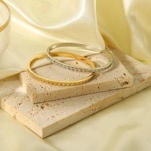 Rhombic diamond-set 18k gold plated stainless steel bangles in gold and silver