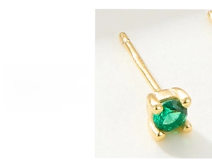 Detail of S925 silver stud earring with green gemstone in a secure 4-prong setting