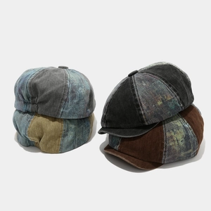 Detail of vintage patchwork newsboy caps with washed denim and corduroy fabric textures