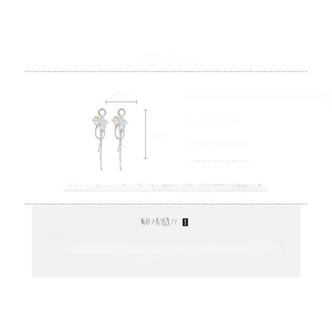 Detailed view of silver needle flower tassel earrings with pearls and rhinestones