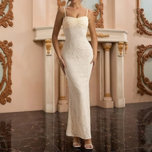 Elegant cream white lace bodycon maxi dress with thin straps in a classic indoor setting