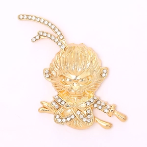 Golden Sun Wukong pendant with sparkling white rhinestones on a clean white background