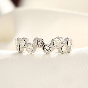 Macro detail of silver adjustable ring featuring wave-pattern micro-pave cubic zirconia