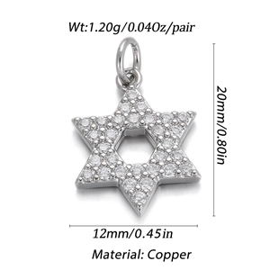Macro view of silver Star of David pendant in copper with clear gemstones and dimensions