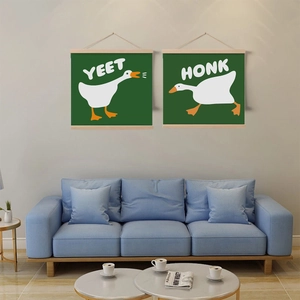 Minimalist duck scroll wall art with Yeet and Honk illustrations over a blue sofa