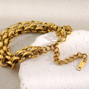 Detailed close-up of a 18K gold-plated stainless steel triple-layer chunky chain bracelet