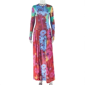 Detail of the colorful digital floral print and elastic fabric on a long sleeve maxi dress