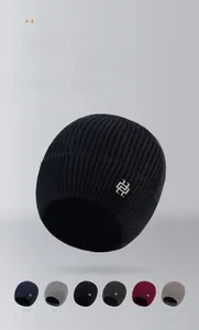 Detailed close-up of thick ribbed knit texture and multi-color winter beanie collection