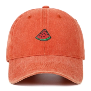 Macro detail of watermelon slice embroidery on vintage washed cotton baseball cap