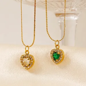 Elegant gold titanium steel necklace featuring white and green heart-shaped crystal pendants