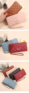 Detail of heart quilted PU leather long wallet showing various colors and wrist strap
