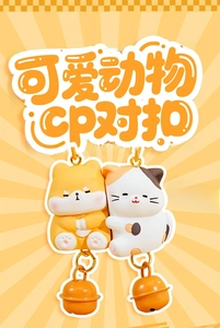Detailed view of cute resin animal keychains featuring shiba inu and cat with bells