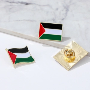 Detail view of Palestine flag metal badges with enamel finish and butterfly clutch backing