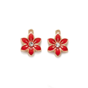 Detail of red flower charms with gold trim and crystal center for jewelry making