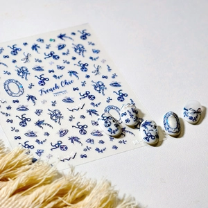 French Chic 3D nail art stickers with vintage blue bows and floral motifs on white background