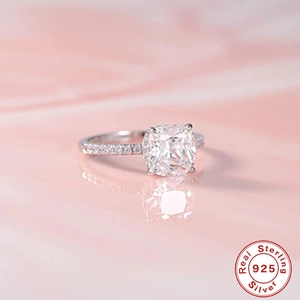 Macro shot of 925 sterling silver ring featuring a square diamond set on pink ripples