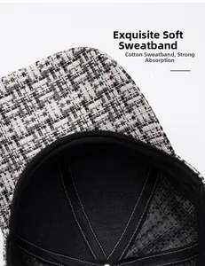 Macro detail of breathable black cotton sweatband inside black and white tweed baseball cap