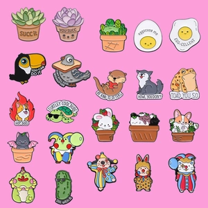 Collection of colorful cartoon animal and plant enamel pins in a grid layout