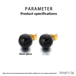 Detailed macro view of 10mm faceted black glass earrings with gold titanium steel posts
