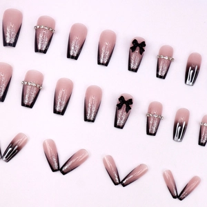 Long coffin fake nails with black French tips, 3D bows and silver glitter gradients