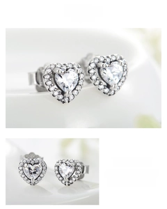 Macro detail of S925 sterling silver heart stud earrings with sparkling cubic zirconia pavé