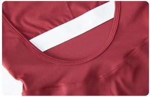 Detail of burgundy yoga bodysuit showing U-shaped back with white elastic strap