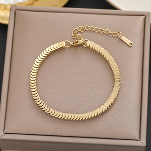 Detailed view of 18k gold plated stainless steel bracelet with fish scale texture