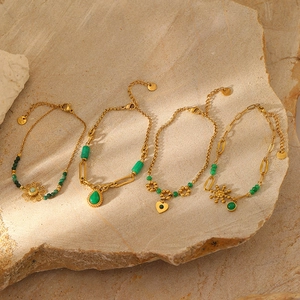 Gold plated stainless steel bracelets featuring natural green stone charms and hearts