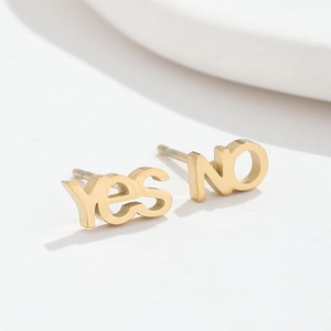 Asymmetric gold stainless steel stud earrings featuring yes and no letter designs