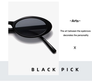 Detail of glossy black oval sunglasses with artistic frame and high shine finish
