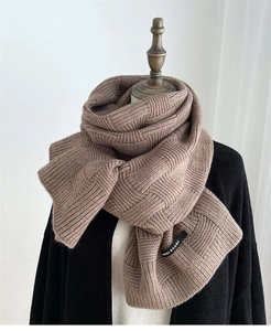 Close-up of brown checkerboard knit wool blend scarf with a small black brand label