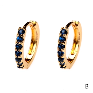 Close-up of 18K gold plated hoop earrings with seven inlaid dark blue zircon stones