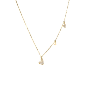 Elegant gold necklace with three zircon heart pendants on a minimalist white background