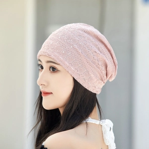 Close-up of pink lace slouchy beanie featuring shimmering rhinestones for women
