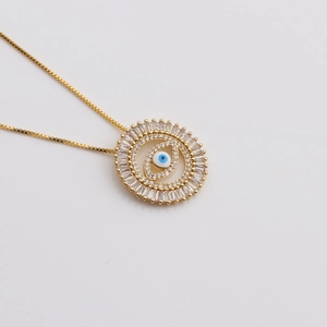 Golden Turkish evil eye necklace with blue zircons and sparkling crystal pendant