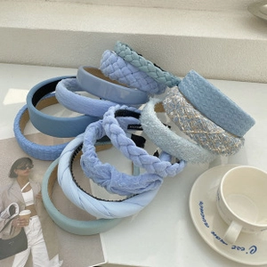 Close-up of assorted blue butterfly hair claws and resin shark clips in various textures