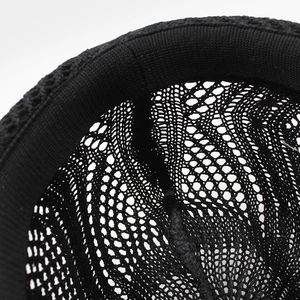 Macro detail of breathable hollow knit structure and inner sweatband on black fedora hat