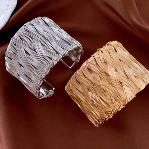 Twisted geometric open cuff bracelet in gold and silver finish for women