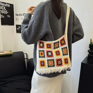 Bohemian granny square crochet tote bag with tassels and colorful geometric knit pattern