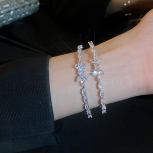 Elegant silver zircon butterfly open bangle with multi-layer crystal accents on wrist