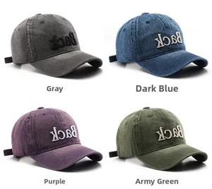 Detail of vintage washed baseball caps in grey, navy, purple and green with Back embroidery