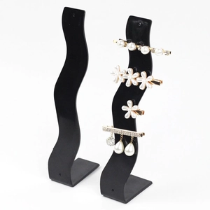 Black S-shaped acrylic hair clip display stand for jewelry and hair accessory storage